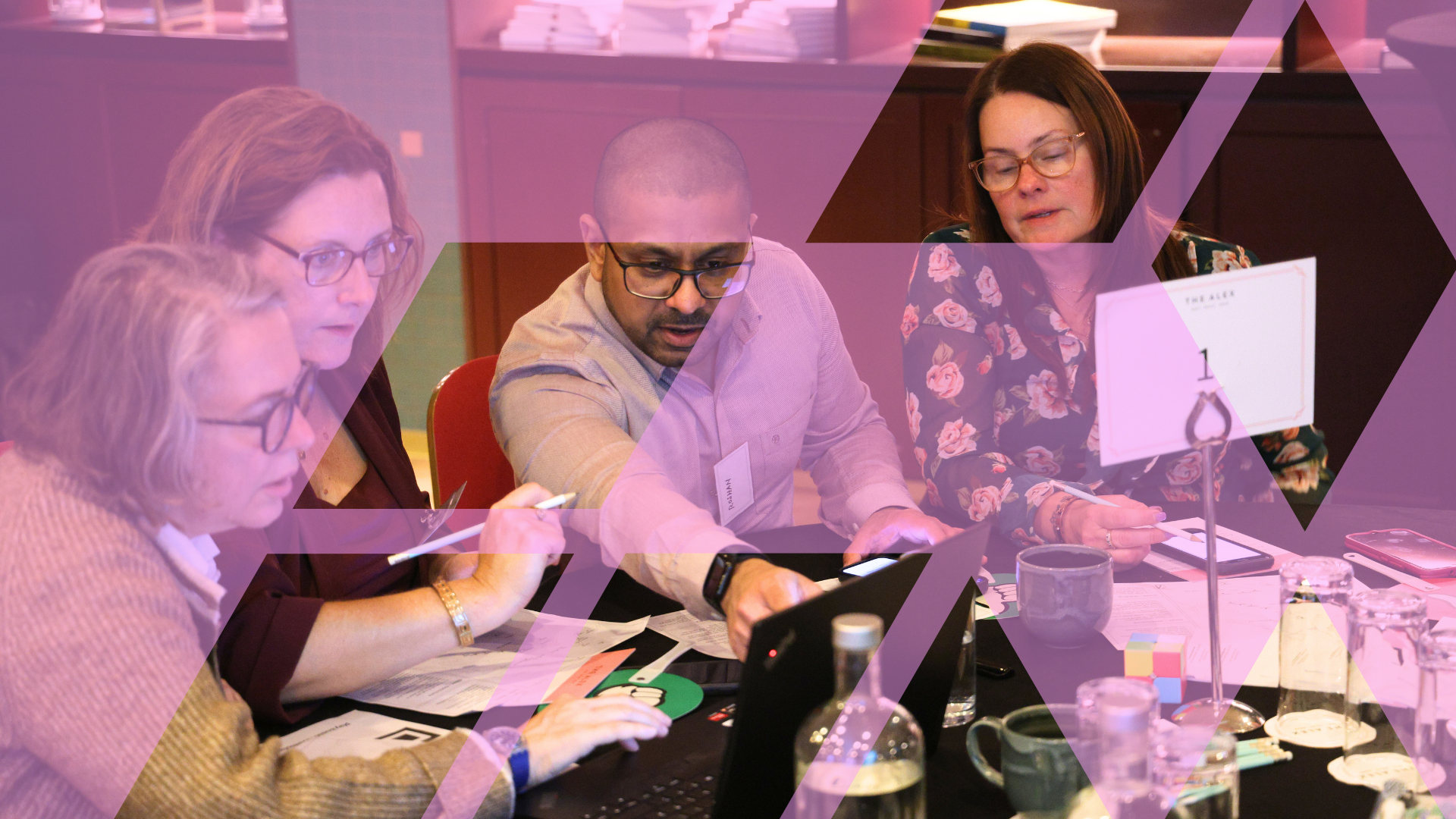 Participants playing a business simulation