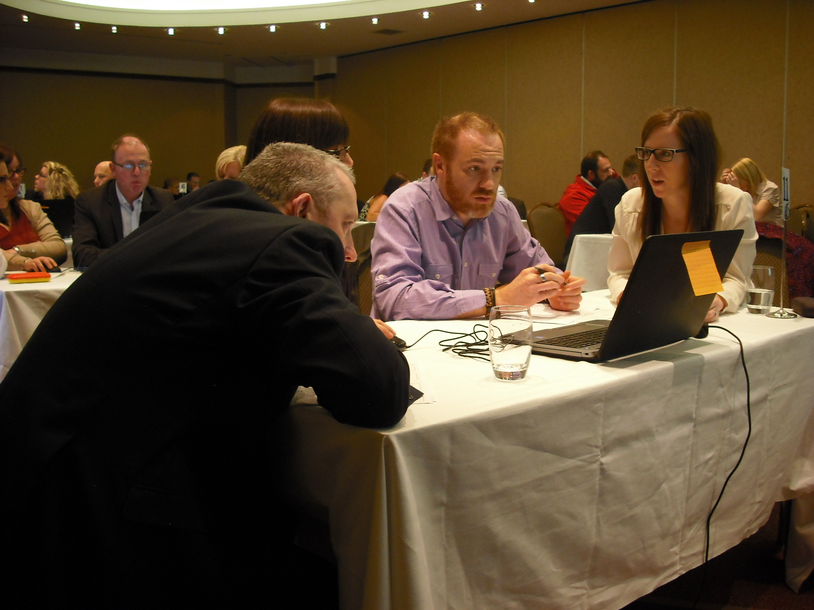 Participants playing the simulation on a laptop